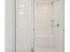 Bright walk-in shower showcasing a tiled bench and rain shower fixture at 3847 S 63Rd Dr, Phoenix, AZ 85043