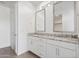 The bathroom includes a dual sink vanity with granite countertops, modern fixtures, and ample space at 3847 S 63Rd Dr, Phoenix, AZ 85043