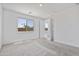 Bright bedroom with two windows allowing natural light, neutral carpet, and a closet entry at 3847 S 63Rd Dr, Phoenix, AZ 85043
