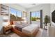 Bright bedroom featuring a large window, a modern aesthetic, and ample natural light at 3847 S 63Rd Dr, Phoenix, AZ 85043