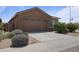 Charming home featuring a two-car garage, landscaped yard, and a welcoming entrance at 3847 S 63Rd Dr, Phoenix, AZ 85043