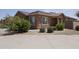 Attractive home exterior with stone accents, desert landscaping, and a paved driveway at 3847 S 63Rd Dr, Phoenix, AZ 85043