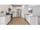 Modern kitchen featuring stainless steel appliances, white cabinets, and granite countertops at 3847 S 63Rd Dr, Phoenix, AZ 85043