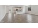 Open-concept living area with sleek tile floors and abundant natural light at 3847 S 63Rd Dr, Phoenix, AZ 85043