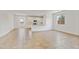Open floor plan connecting the living area to the kitchen, featuring white cabinets at 3847 S 63Rd Dr, Phoenix, AZ 85043