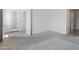 A spacious main bedroom featuring neutral carpet, an ensuite bathroom entrance, and a closet entrance at 3847 S 63Rd Dr, Phoenix, AZ 85043