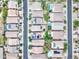 Aerial view of a neighborhood showcasing houses with pools, solar panels, and well-maintained landscaping at 4328 W Judson Dr, New River, AZ 85087