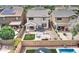 Aerial view of a backyard featuring a patio, trampoline, swing set, and lush green grass at 4328 W Judson Dr, New River, AZ 85087