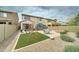 Expansive backyard with a patio, trampoline, dining set, fire pit, swing set, and desert landscaping at 4328 W Judson Dr, New River, AZ 85087