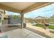 Spacious backyard with patio, trampoline, swing set, dining area, and desert landscaping at 4328 W Judson Dr, New River, AZ 85087