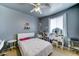 Gray bedroom featuring a white bed and vanity with a ceiling fan at 4328 W Judson Dr, New River, AZ 85087