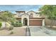 Charming two-story home featuring a well-manicured lawn and a two-car garage at 4328 W Judson Dr, New River, AZ 85087