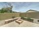 Cozy backyard fire pit area with seating and desert landscaping at 4328 W Judson Dr, New River, AZ 85087