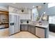 Well-lit kitchen featuring stainless steel appliances, sleek countertops, and modern backsplash at 4328 W Judson Dr, New River, AZ 85087