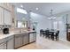 Open kitchen with modern appliances, double sink, and adjacent dining area at 4328 W Judson Dr, New River, AZ 85087