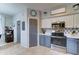 Well-lit kitchen featuring stainless steel appliances, sleek countertops, and modern backsplash at 4328 W Judson Dr, New River, AZ 85087