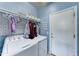 Well-organized laundry room with modern washer and dryer, tiled accent wall, and ample storage space at 4328 W Judson Dr, New River, AZ 85087