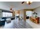 Bright living room showcasing hardwood floors, ceiling fans, and neutral wall paint at 4328 W Judson Dr, New River, AZ 85087