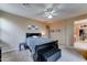 Bedroom featuring a ceiling fan, neutral carpet, and wall decor at 4328 W Judson Dr, New River, AZ 85087