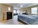 Spacious main bedroom featuring neutral carpet, a ceiling fan, and lots of natural light at 4328 W Judson Dr, New River, AZ 85087