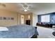 Spacious main bedroom featuring neutral carpet, a ceiling fan, and lots of natural light at 4328 W Judson Dr, New River, AZ 85087