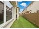 Neat backyard featuring artificial grass and a sturdy block wall for privacy at 4353 E Erie St, Gilbert, AZ 85295