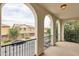 Balcony with metal railing and arches providing a panoramic view of the neighborhood and street at 4353 E Erie St, Gilbert, AZ 85295