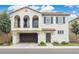 Beautiful two-story home featuring stucco siding, a two-car garage and arched doorway to a charming balcony at 4353 E Erie St, Gilbert, AZ 85295