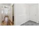 Hallway featuring wood floors and neutral walls leading to a doorway at the end of the hall at 4353 E Erie St, Gilbert, AZ 85295