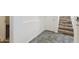 Hallway featuring tiled flooring, neutral walls, and a staircase with wood-look steps at 4353 E Erie St, Gilbert, AZ 85295