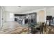 Bright and spacious kitchen featuring an island with bar seating, and dark cabinetry, perfect for cooking and gathering at 4353 E Erie St, Gilbert, AZ 85295