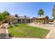 Spacious backyard with lush lawn, a pergola-covered patio, and a charming gazebo at 45 S Rita Ln, Chandler, AZ 85226