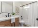 Updated bathroom with modern vanity, black fixtures, and framed mirror at 45 S Rita Ln, Chandler, AZ 85226