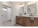Bathroom with double vanity, modern fixtures, and shower-tub combination at 45 S Rita Ln, Chandler, AZ 85226