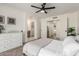 Bright bedroom with ceiling fan, neutral tones, and doorway to closet at 45 S Rita Ln, Chandler, AZ 85226