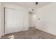 Bedroom featuring neutral tones, carpet flooring, and double door closet at 45 S Rita Ln, Chandler, AZ 85226