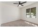 Bedroom featuring neutral tones, carpet flooring and a ceiling fan at 45 S Rita Ln, Chandler, AZ 85226