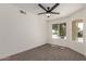 Bedroom featuring neutral tones, carpet flooring and a ceiling fan at 45 S Rita Ln, Chandler, AZ 85226