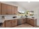 Stylish kitchen featuring wooden cabinets, stainless steel appliances, and modern finishes at 45 S Rita Ln, Chandler, AZ 85226