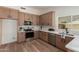 Well-lit kitchen with wooden cabinets, stainless steel appliances, and white countertops at 45 S Rita Ln, Chandler, AZ 85226