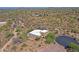 This aerial view showcases this custom home in a desert community with views at 5520 E Desert Forest Trl, Cave Creek, AZ 85331