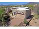 Aerial view of stucco house with desert landscaping, brick driveway, mountain views, and three-car garage at 5520 E Desert Forest Trl, Cave Creek, AZ 85331