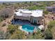 This aerial view showcases a private backyard oasis with a pool, spa and plenty of space for outdoor entertaining at 5520 E Desert Forest Trl, Cave Creek, AZ 85331