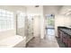 Spacious bathroom featuring a glass shower, a tub, and a dark wood vanity with granite countertop at 5520 E Desert Forest Trl, Cave Creek, AZ 85331