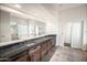 Modern bathroom featuring dual sinks, granite countertops, and a separate shower and tub at 5520 E Desert Forest Trl, Cave Creek, AZ 85331