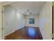Spacious bedroom with hardwood floors, ceiling fan, and a large window at 5520 E Desert Forest Trl, Cave Creek, AZ 85331