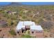 Aerial view of the custom home featuring a clean roofline, and desert landscaping in a serene environment at 5520 E Desert Forest Trl, Cave Creek, AZ 85331