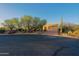 Charming home featuring desert landscaping, including cacti, with brick driveway and three car garage at 5520 E Desert Forest Trl, Cave Creek, AZ 85331