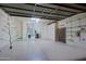Spacious garage featuring epoxy flooring, ample storage cabinets, and shelving for organization at 5520 E Desert Forest Trl, Cave Creek, AZ 85331