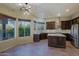 Bright eat-in kitchen boasting stainless steel appliances and an island with a breakfast bar at 5520 E Desert Forest Trl, Cave Creek, AZ 85331